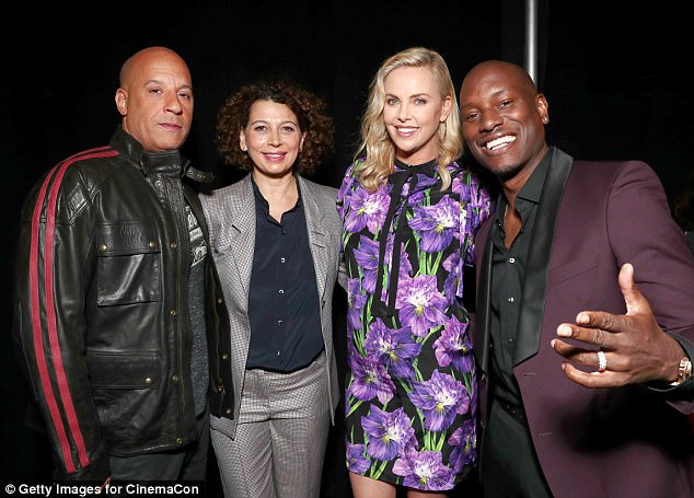 Good vibes: During an interview at the event, co-star Vin Diesel (left) couldn't say enough good things about working with Charlize