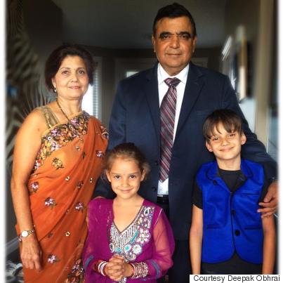 Deepak Obhrai with his wife, and their grandkids Davin, 10, and Evasha, 8.